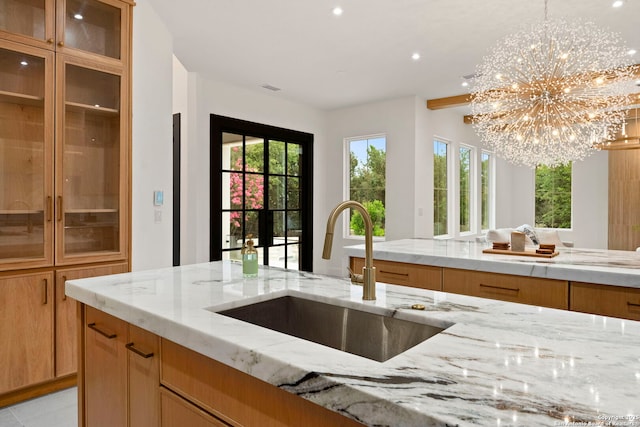 6 Turin Ct, San Antonio, TX 78257 - kitchen featuring a chandelier, light stone counters, recessed lighting, and pendant lighting