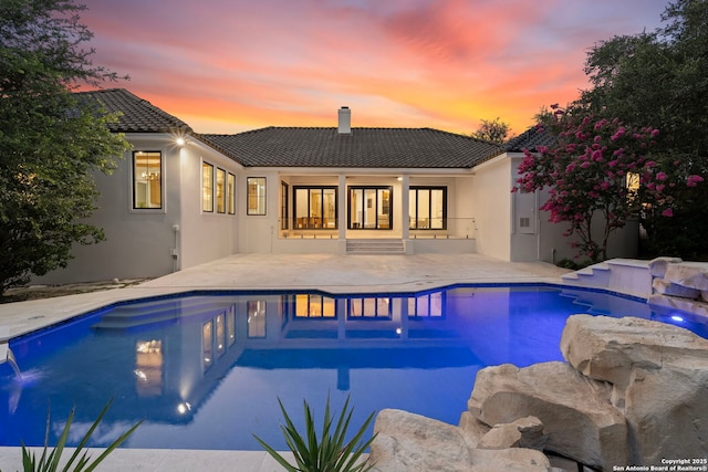 6 Turin Ct, San Antonio, TX 78257 - pool at dusk with a patio area and an outdoor pool