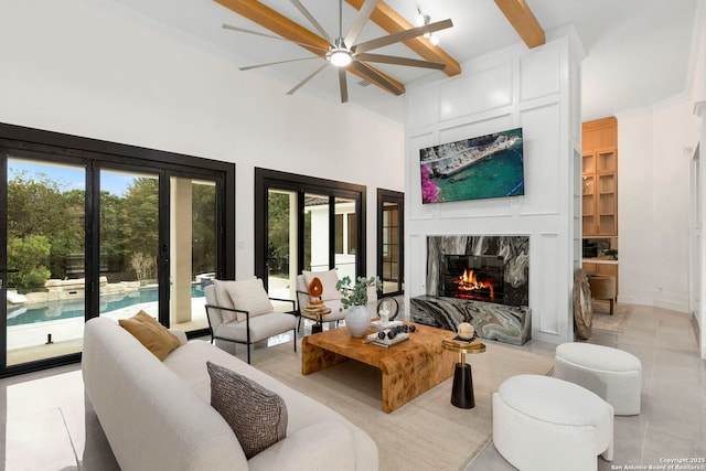 6 Turin Ct, San Antonio, TX 78257 - living room featuring a high ceiling, a premium fireplace, beam ceiling, and ceiling fan