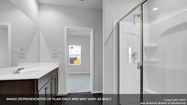 21039 Watercourse Way, San Antonio, TX 78266 - bathroom with vanity and a shower stall