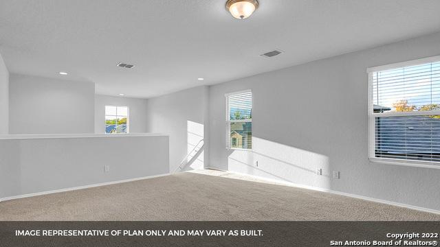 21039 Watercourse Way, San Antonio, TX 78266 - carpeted spare room with baseboards and recessed lighting
