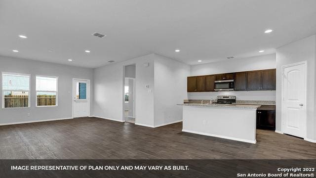 21039 Watercourse Way, San Antonio, TX 78266 - kitchen featuring appliances with stainless steel finishes, dark wood-style floors, recessed lighting, open floor plan, and dark brown cabinetry