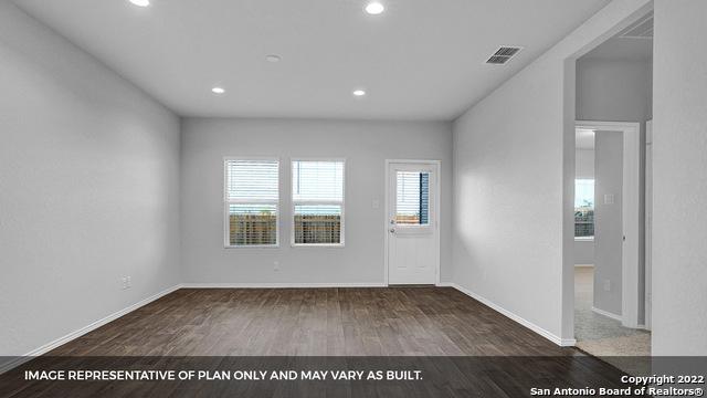 21039 Watercourse Way, San Antonio, TX 78266 - spare room with wood finished floors and recessed lighting