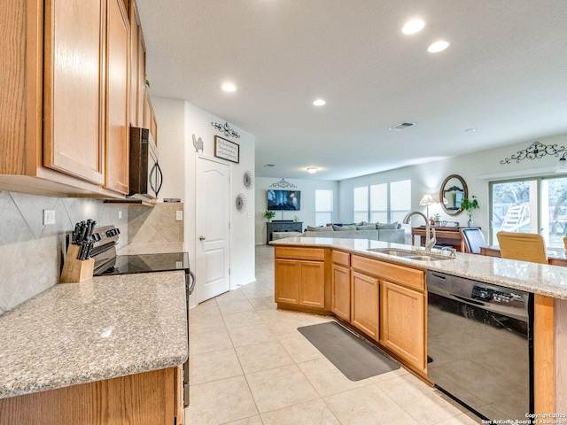20127 Silver Strm, San Antonio, TX 78259 - kitchen featuring stainless steel appliances, open floor plan, tasteful backsplash, recessed lighting, and light stone counters