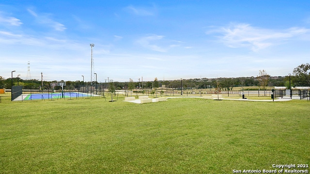 22716 Match Play, San Antonio, TX 78261 - view of property's community with a lawn and a swimming pool