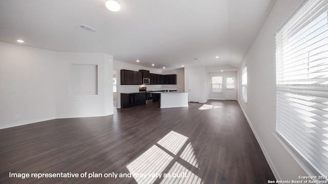 22716 Match Play, San Antonio, TX 78261 - unfurnished living room with dark wood-style floors and recessed lighting
