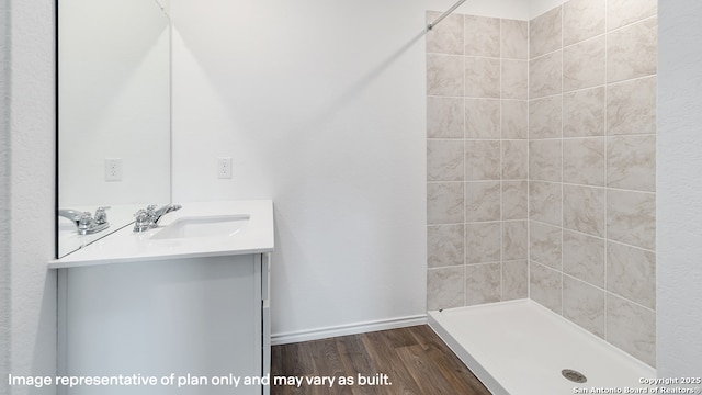 22926 Double Bogey, San Antonio, TX 78261 - full bathroom with vanity, tiled shower, and wood finished floors