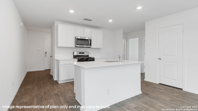 22926 Double Bogey, San Antonio, TX 78261 - kitchen with appliances with stainless steel finishes, wood finished floors, white cabinetry, and recessed lighting