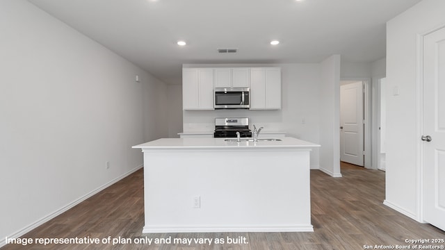 22926 Double Bogey, San Antonio, TX 78261 - kitchen with appliances with stainless steel finishes, wood finished floors, recessed lighting, light countertops, and white cabinets