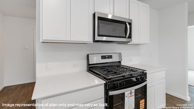 22926 Double Bogey, San Antonio, TX 78261 - kitchen with stainless steel appliances, dark wood finished floors, and white cabinetry