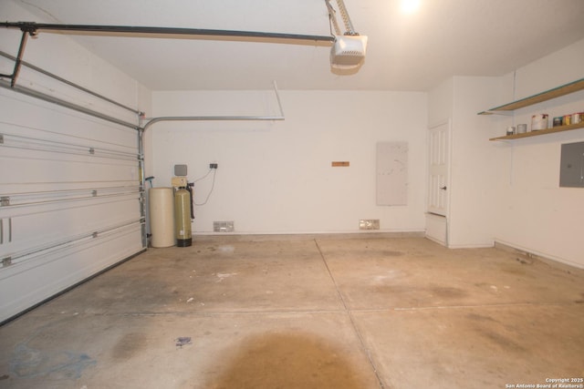 4602 Manitou Bay, San Antonio, TX 78259 - garage with a garage door opener and electric panel