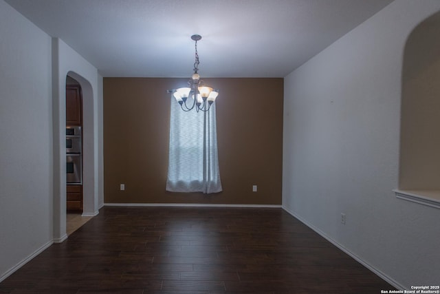 4602 Manitou Bay, San Antonio, TX 78259 - empty room with arched walkways, dark wood-style floors, and a chandelier