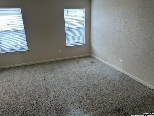 4606 Gambels Quail, Converse, TX 78109 - carpeted empty room featuring healthy amount of natural light and a textured wall
