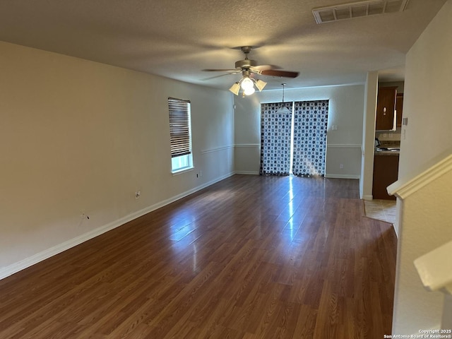 4606 Gambels Quail, Converse, TX 78109 - unfurnished room featuring ceiling fan and dark wood-style flooring