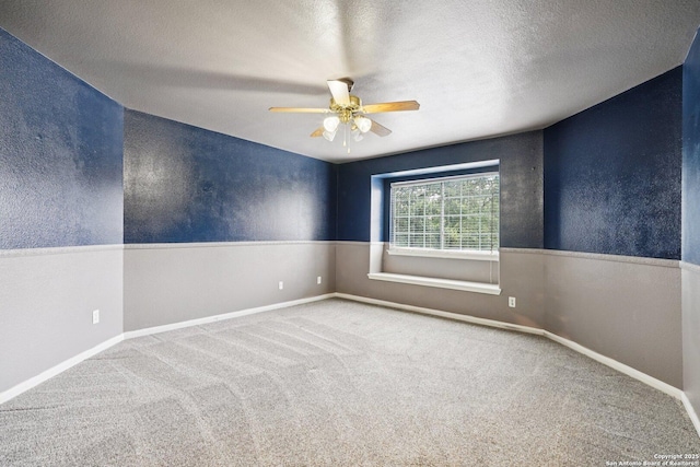 519 Catanbo, San Antonio, TX 78258 - spare room featuring ceiling fan, carpet flooring, a textured ceiling, and wainscoting