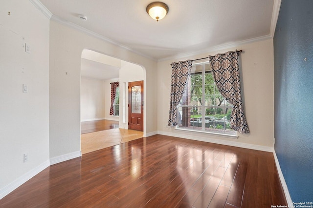 519 Catanbo, San Antonio, TX 78258 - spare room featuring arched walkways, wood finished floors, and ornamental molding