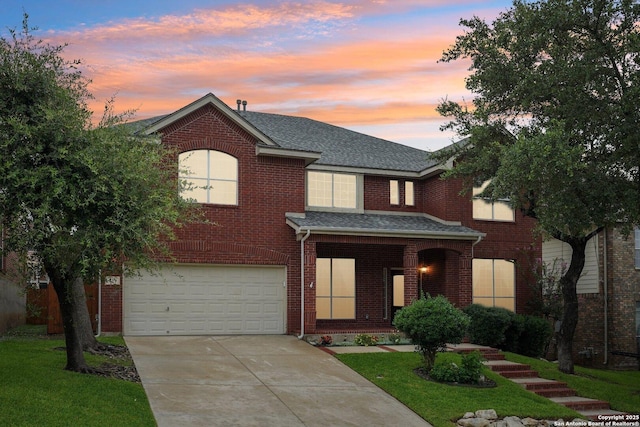 519 Catanbo, San Antonio, TX 78258 - traditional-style house with an attached garage, concrete driveway, brick siding, roof with shingles, and covered porch