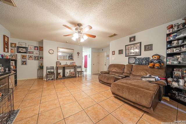 11002 Stagwood Pass, San Antonio, TX 78254 - living room with a ceiling fan, light tile patterned floors, and a textured ceiling