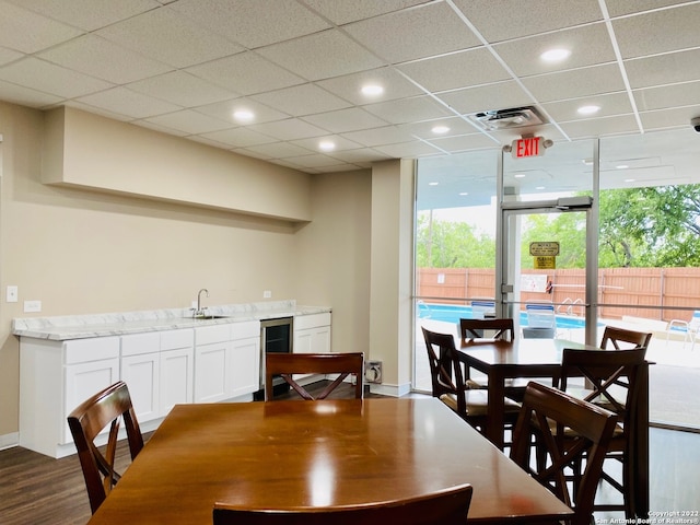 7039 San Pedro Ave Unit 601, San Antonio, TX 78216 - dining room featuring wine cooler, wet bar, dark wood finished floors, and recessed lighting