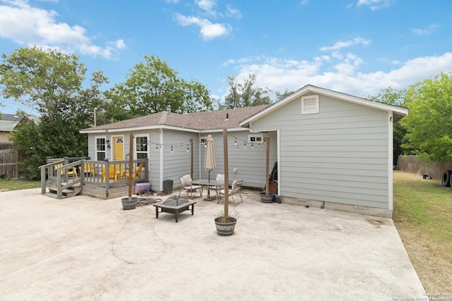 802 Poinsettia, San Antonio, TX 78202 - rear view of house with a patio area, an outdoor fire pit, a deck, and a shingled roof