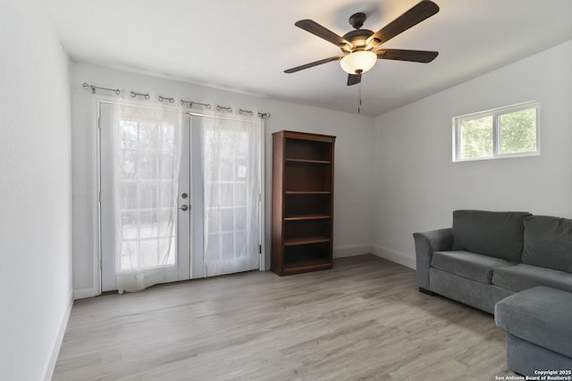802 Poinsettia, San Antonio, TX 78202 - living room with wood finished floors, ceiling fan, and french doors