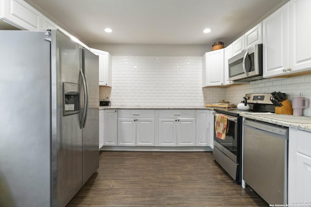 802 Poinsettia, San Antonio, TX 78202 - kitchen with stainless steel appliances, white cabinetry, decorative backsplash, recessed lighting, and light stone countertops