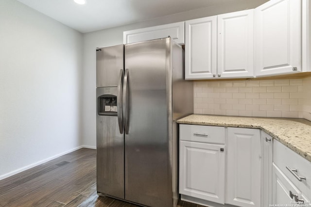 802 Poinsettia, San Antonio, TX 78202 - kitchen with stainless steel fridge, white cabinetry, decorative backsplash, dark wood-type flooring, and light stone counters