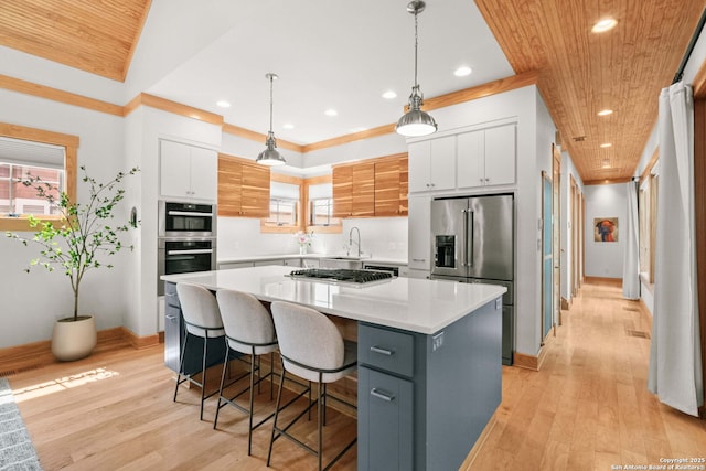 217 Alta, San Antonio, TX 78209 - kitchen featuring stainless steel appliances, a center island, white cabinets, recessed lighting, and light countertops