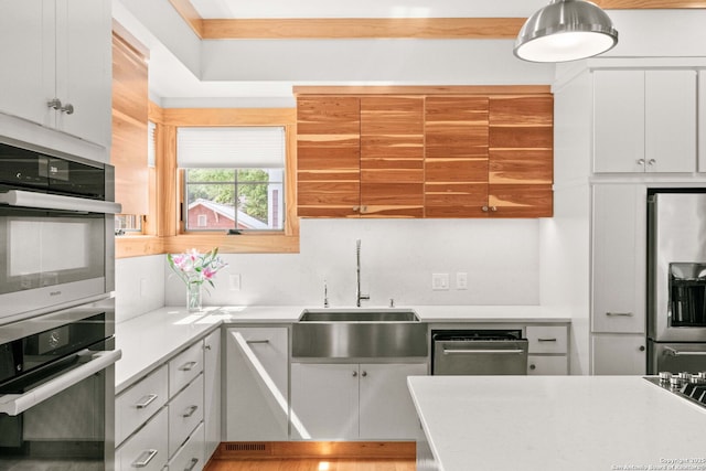 217 Alta, San Antonio, TX 78209 - kitchen featuring stainless steel appliances, light countertops, and white cabinetry