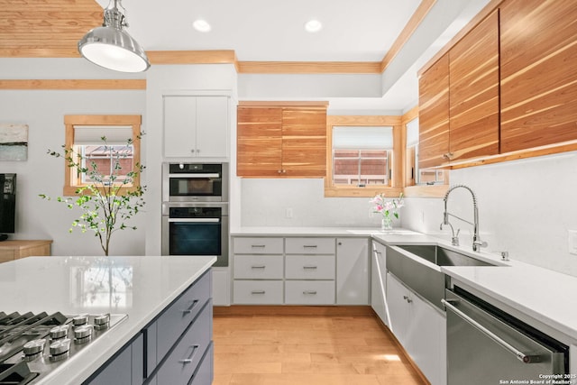 217 Alta, San Antonio, TX 78209 - kitchen with stainless steel appliances, white cabinetry, light countertops, recessed lighting, and light wood-style floors