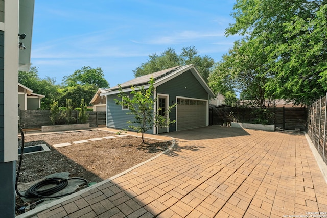 217 Alta, San Antonio, TX 78209 - fenced backyard featuring a garden and a garage