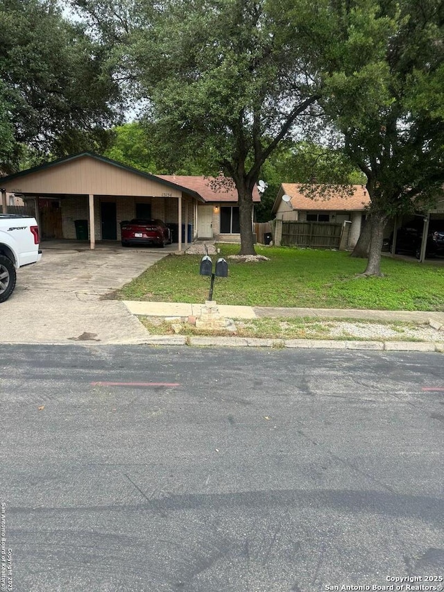 13136 Los Espanada, San Antonio, TX 78233 - view of front facade featuring an attached carport and concrete driveway