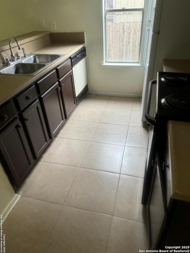 13136 Los Espanada, San Antonio, TX 78233 - kitchen featuring dishwasher and light tile patterned floors