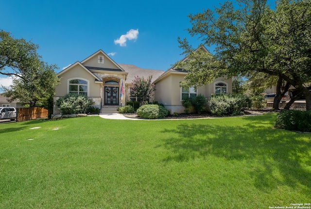 26130 Sunny Mdw, San Antonio, TX 78260 - view of front of home featuring stucco siding, french doors, and a front lawn