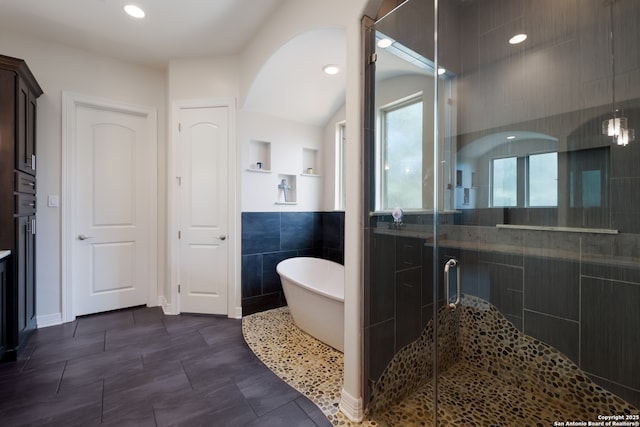 26130 Sunny Mdw, San Antonio, TX 78260 - bathroom with a freestanding bath, a stall shower, tile walls, and recessed lighting