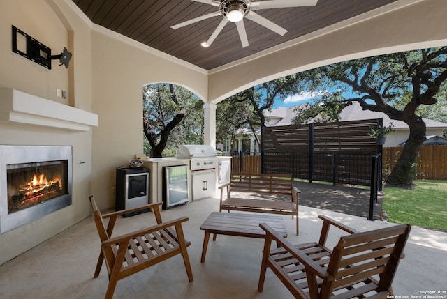 26130 Sunny Mdw, San Antonio, TX 78260 - view of patio / terrace with a warm lit fireplace, area for grilling, and ceiling fan