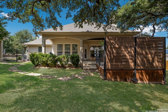 26130 Sunny Mdw, San Antonio, TX 78260 - rear view of house featuring stucco siding and roof with shingles