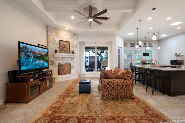 26130 Sunny Mdw, San Antonio, TX 78260 - living room with a ceiling fan, recessed lighting, beam ceiling, ornamental molding, and a tray ceiling