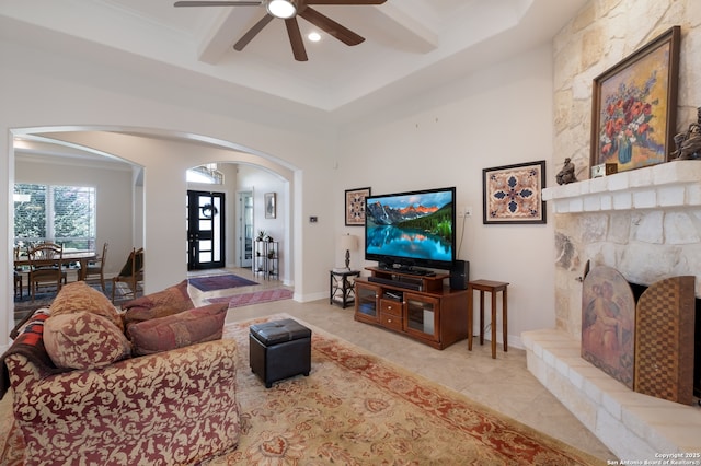 26130 Sunny Mdw, San Antonio, TX 78260 - living room featuring arched walkways, a ceiling fan, a fireplace, crown molding, and recessed lighting
