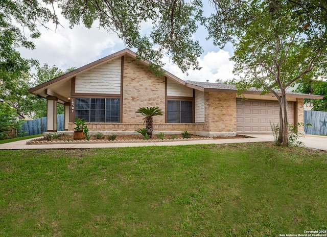 16507 Willow Run, San Antonio, TX 78247 - mid-century modern home with brick siding, a garage, and driveway