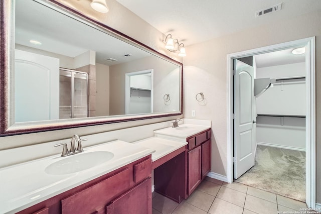 13059 Cache, San Antonio, TX 78253 - bathroom featuring a spacious closet, double vanity, a shower stall, and tile patterned floors