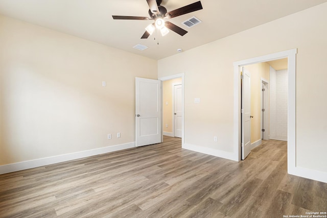302 Riley Way, Kerrville, TX 78028 - unfurnished bedroom with light wood-style flooring and a ceiling fan