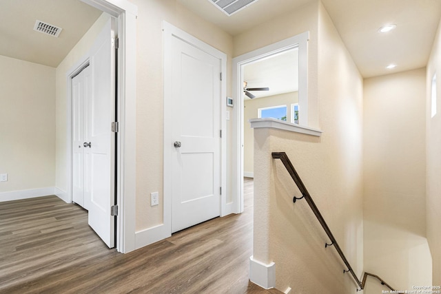 302 Riley Way, Kerrville, TX 78028 - corridor with an upstairs landing, wood finished floors, and recessed lighting