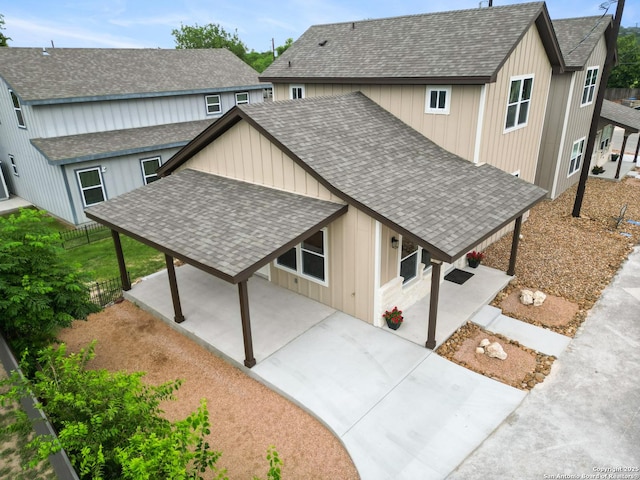 302 Riley Way, Kerrville, TX 78028 - view of front facade featuring a shingled roof, driveway, and a carport