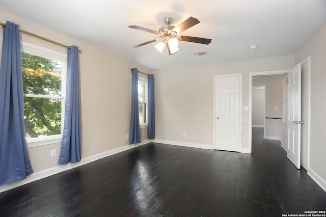 1002 Kampmann Blvd, San Antonio, TX 78201 - unfurnished room with dark wood finished floors, a ceiling fan, and a smoke detector