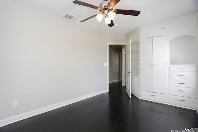 1002 Kampmann Blvd, San Antonio, TX 78201 - unfurnished bedroom featuring dark wood-style floors, a ceiling fan, and a closet