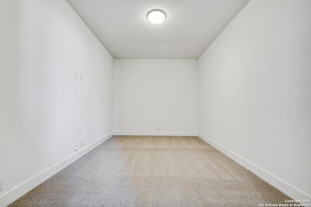 228 Dulce Vis, Boerne, TX 78006 - empty room with light carpet and baseboards
