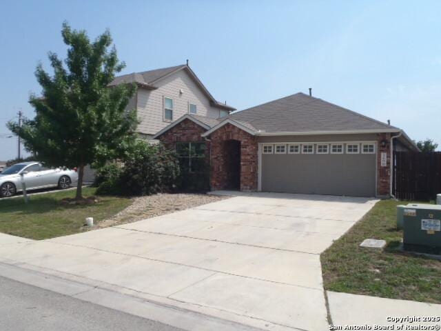 2690 Mccrae, New Braunfels, TX 78130 - view of front of property featuring a garage and concrete driveway