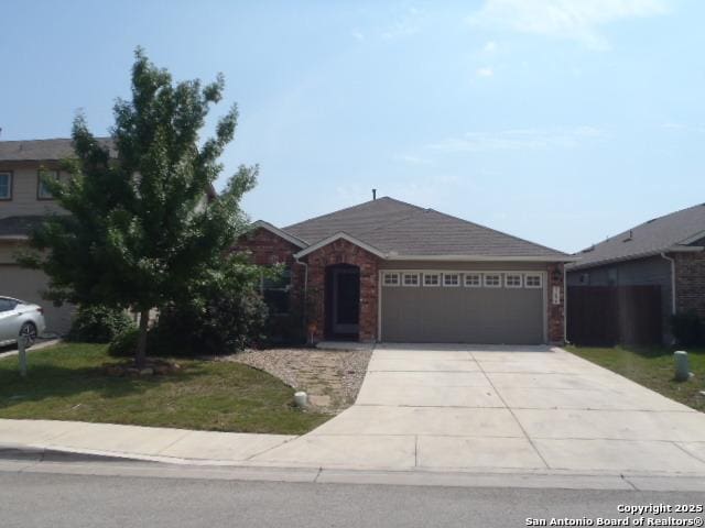 2690 Mccrae, New Braunfels, TX 78130 - ranch-style house with a garage, driveway, and brick siding