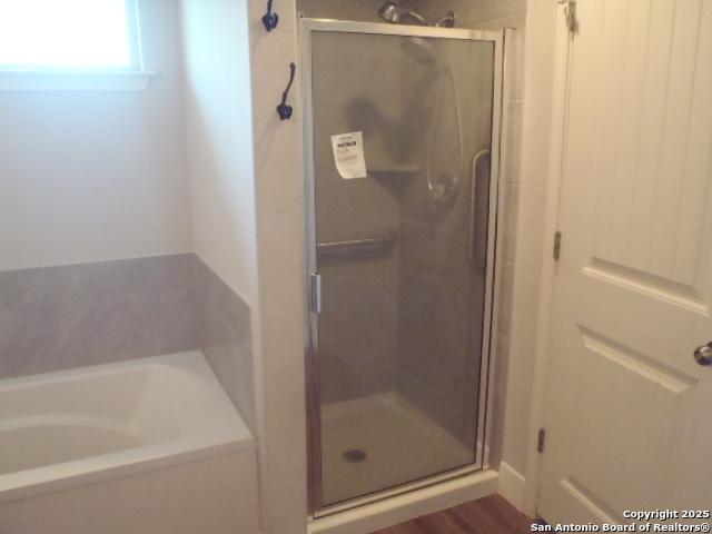 2690 Mccrae, New Braunfels, TX 78130 - full bath featuring a garden tub and a shower stall